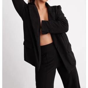 NEW WOLVEN four-way stretch onyx blazer in black